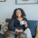 Woman sitting and enjoying a cup of coffee