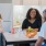 Friends standing around a kitchen island talking 