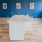 Large community kitchen with wood floors and ample seating 