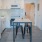Spacious and well lit kitchen with tile floors and white appliances 