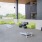 Spacious covered patio with seating and cornhole 